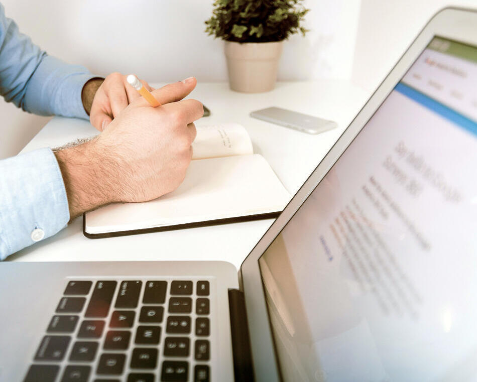 Man working with laptop desk Man working with laptop desk
